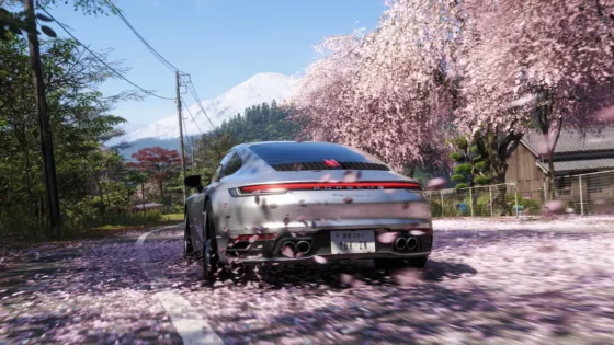 forza horizon 6 screenshot showing cherry blossoms and a porsche